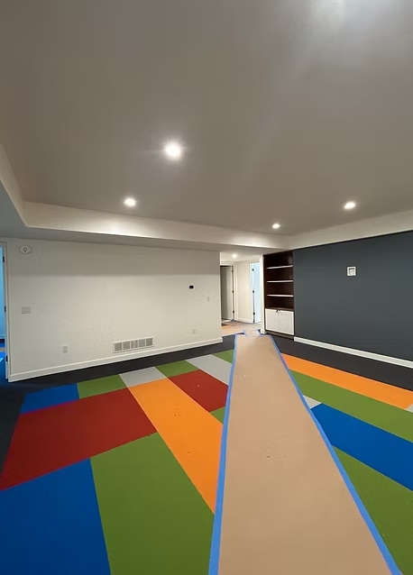 Custom geometric basement playroom painted in vibrant colors by GRC Painting